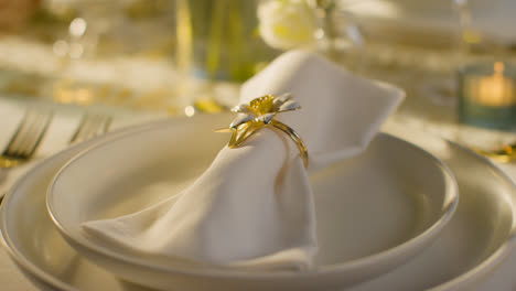 Close-Up-Of-Napkin-In-Ring-On-Table-Set-For-Meal-At-Wedding-Reception-In-Restaurant-4